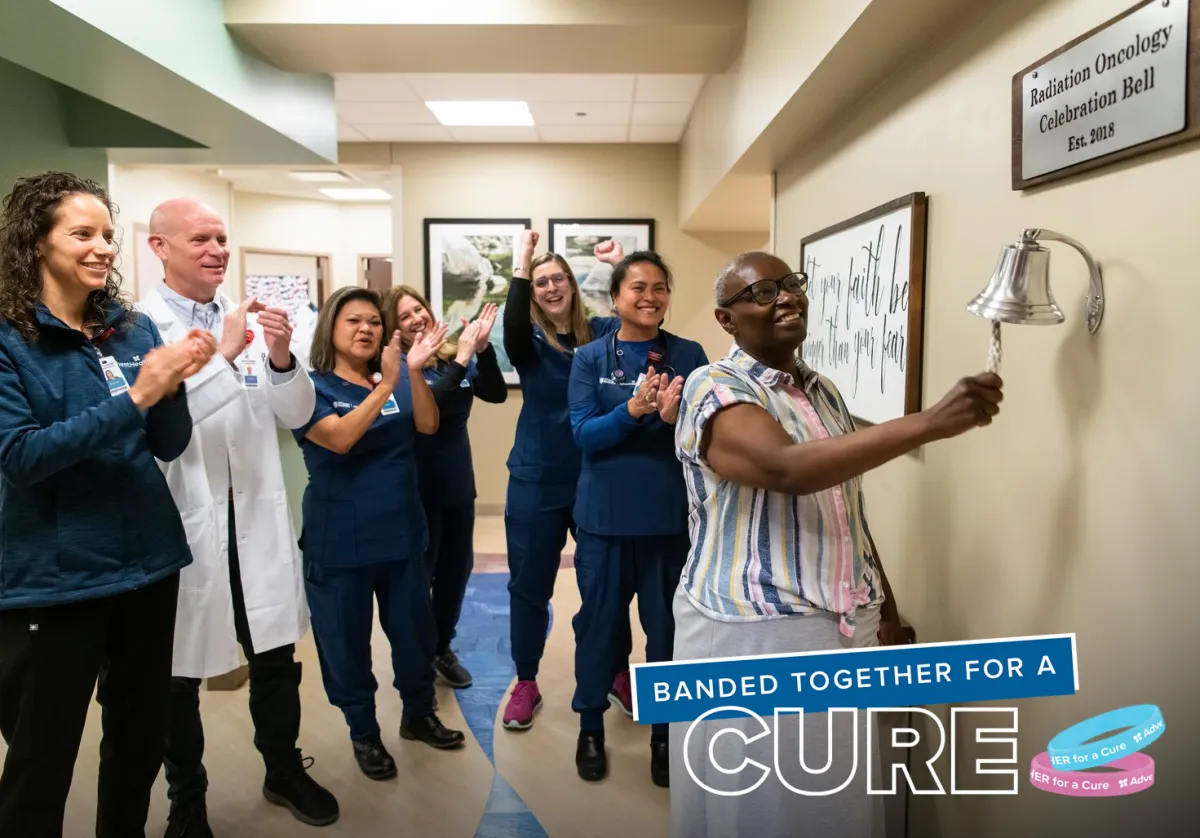 a cancer survivor ringing a bell