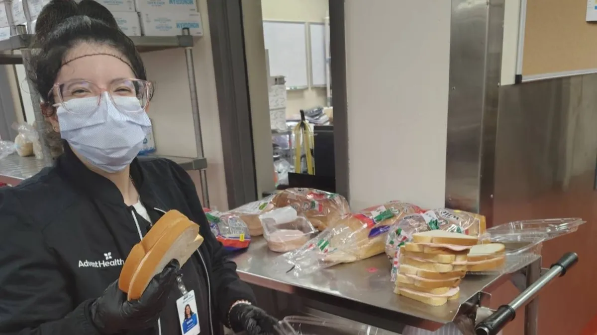 Woman with sandwich bread