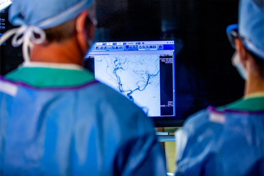 Dr. James Lefler studies a blood clot in a stroke patient