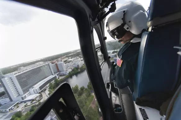 1.	Todd Collette, RRT, scans the approach to AdventHealth Orlando as a Flight 1 helicopter brings a mock patient to the emergency room. 