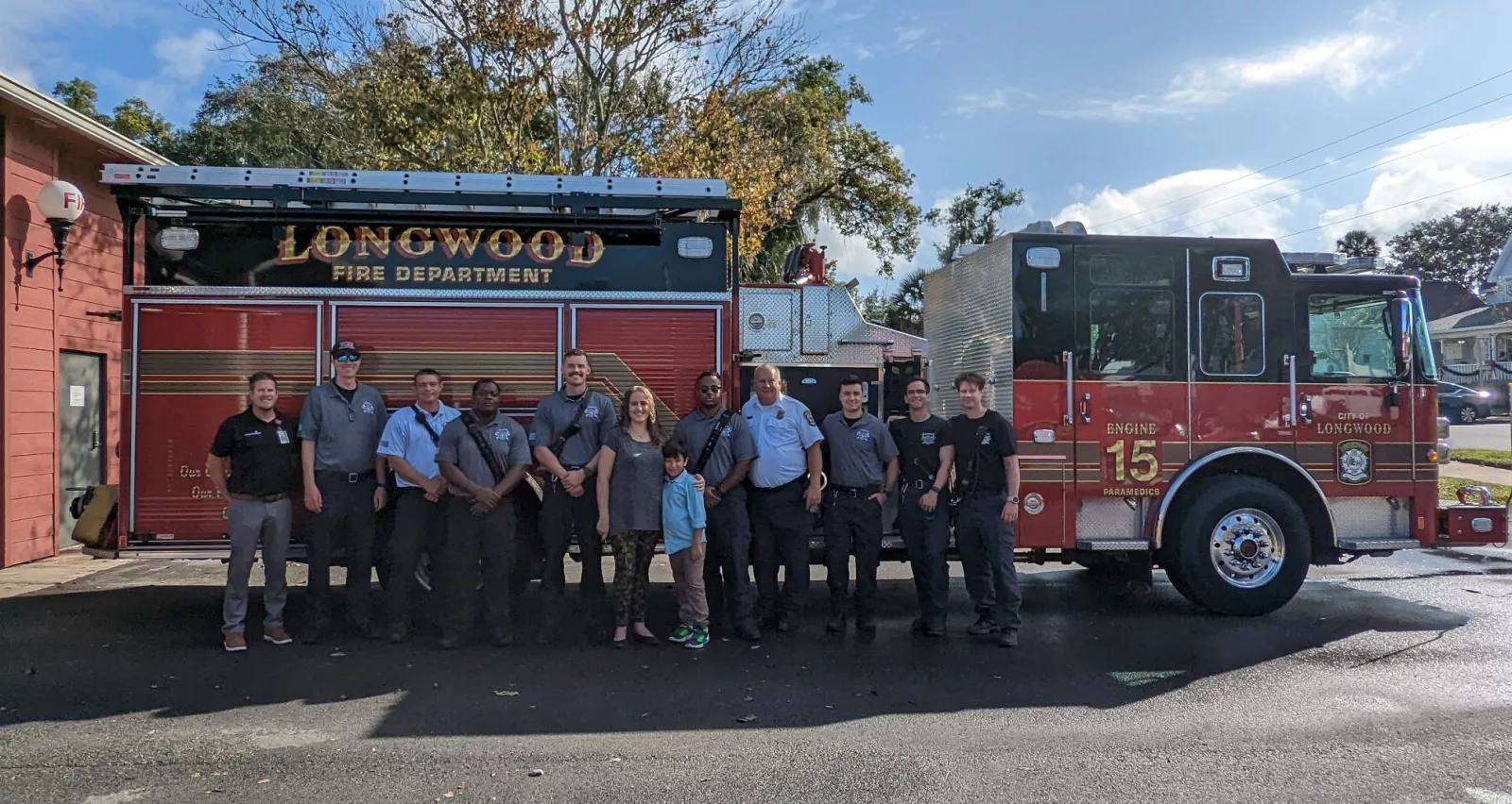 Holly Mahedeo and son thank the group of first responders from Longwood Fire and Rescue who helped save her life from stroke.