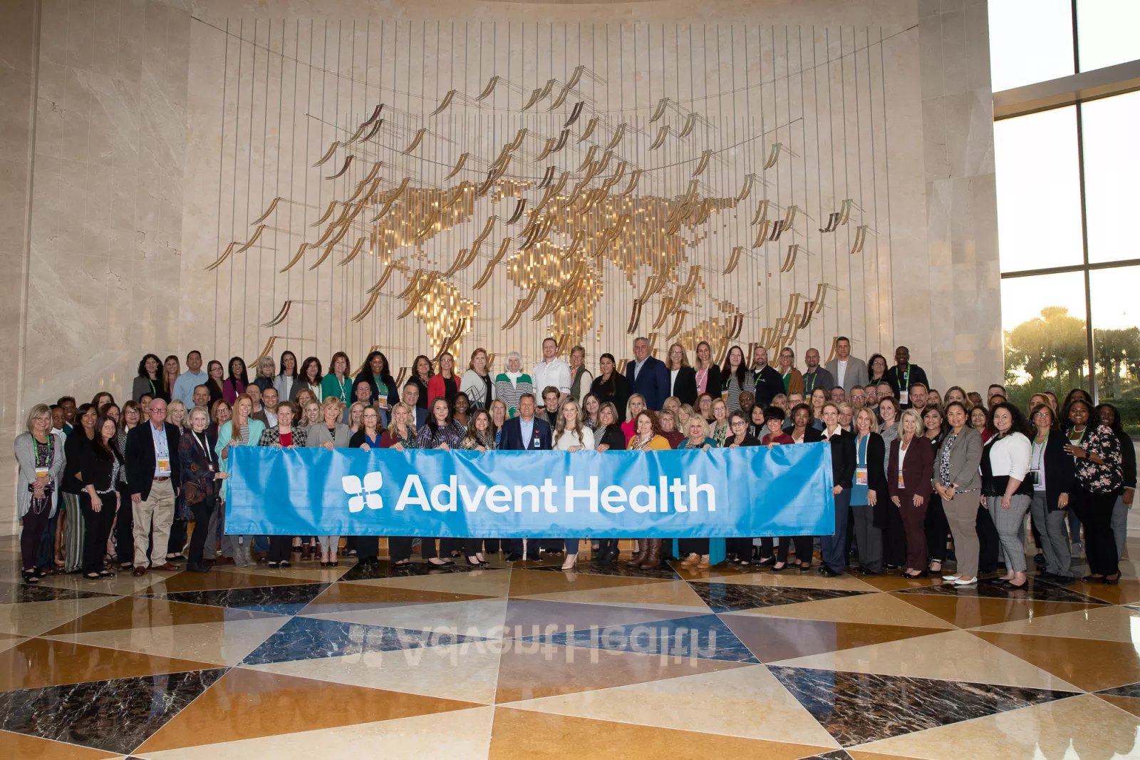 AdventHealth CEO Terry Shaw (middle) and leaders representing Guardian of Excellence Award winners – AdventHealth Gordon Outpatient Oncology, AdventHealth Palm Harbor ER and AdventHealth South Overland Park ER – celebrate patient experience excellence at Press Ganey’s National Client & Executive Leadership Conference.