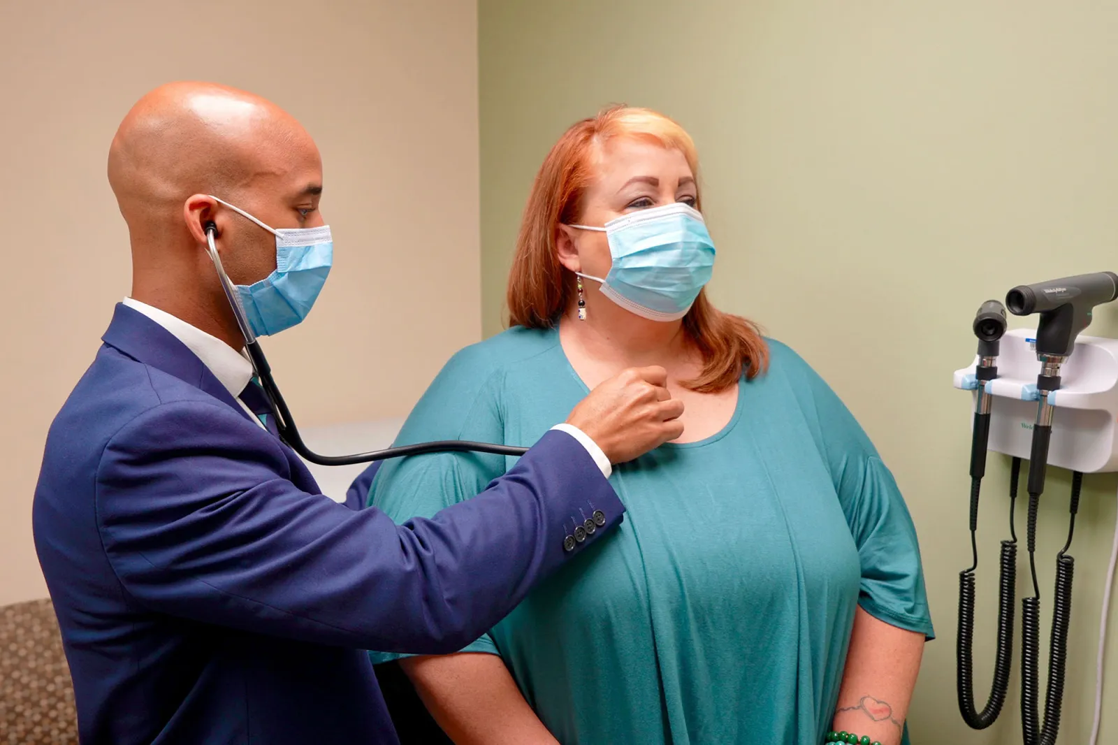 Post-COVID Clinic lead physician, Dwayne Gordon, M.D., sees a long COVID-19 patient at the clinic.