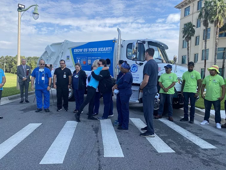 Celebration family honors son’s life-saving organ donation with memorial tribute and public education message on the latest Celebration Sanitation service truck