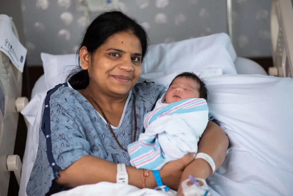 mother holds newborn baby