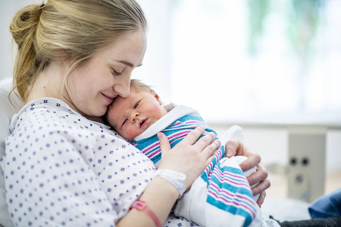 mother holds newborn baby