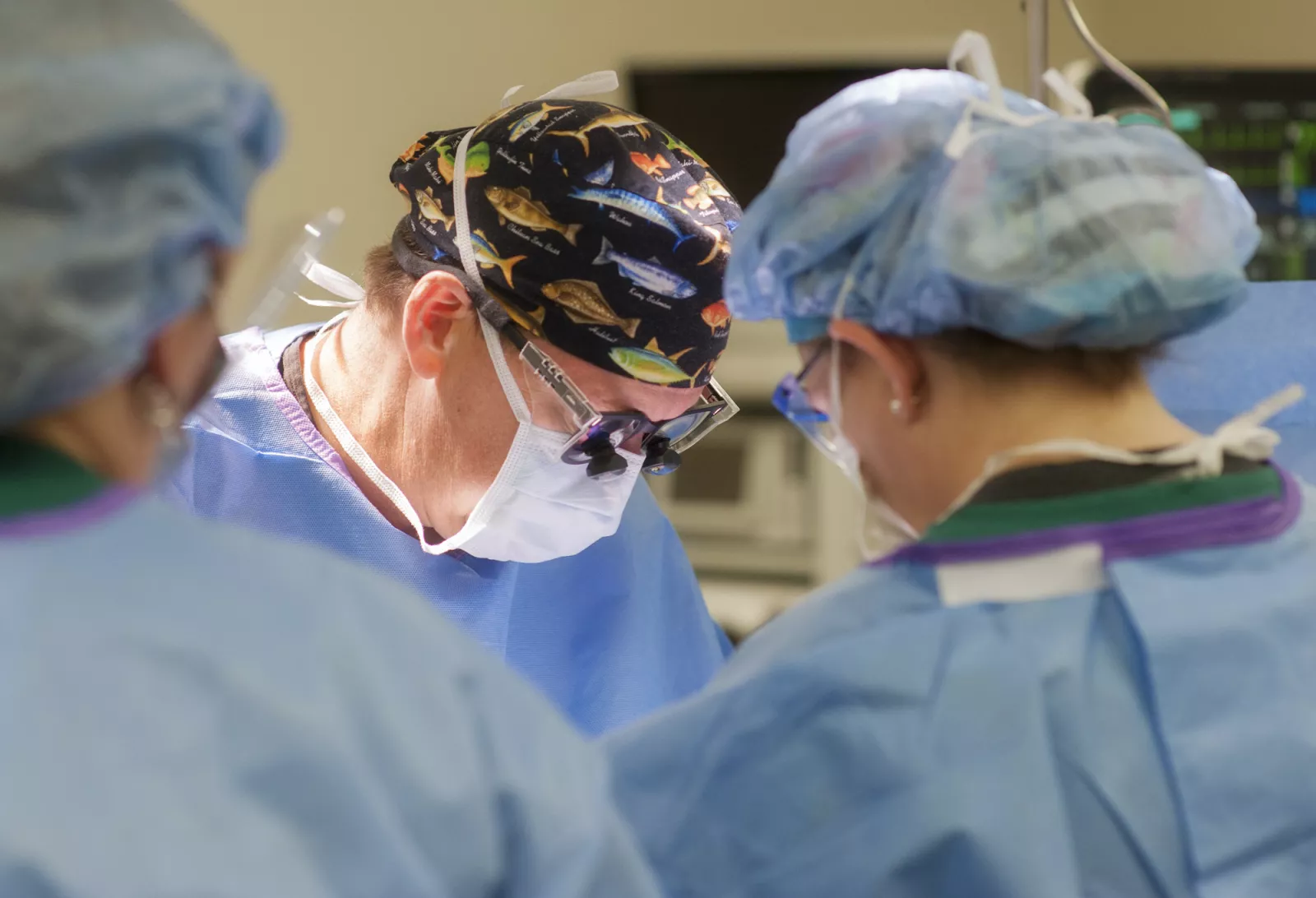 Group of surgeons operating on a patient.