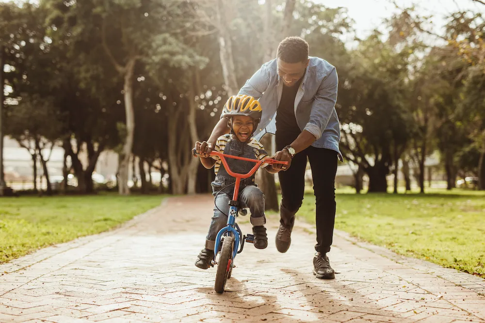 Man and son ride bike