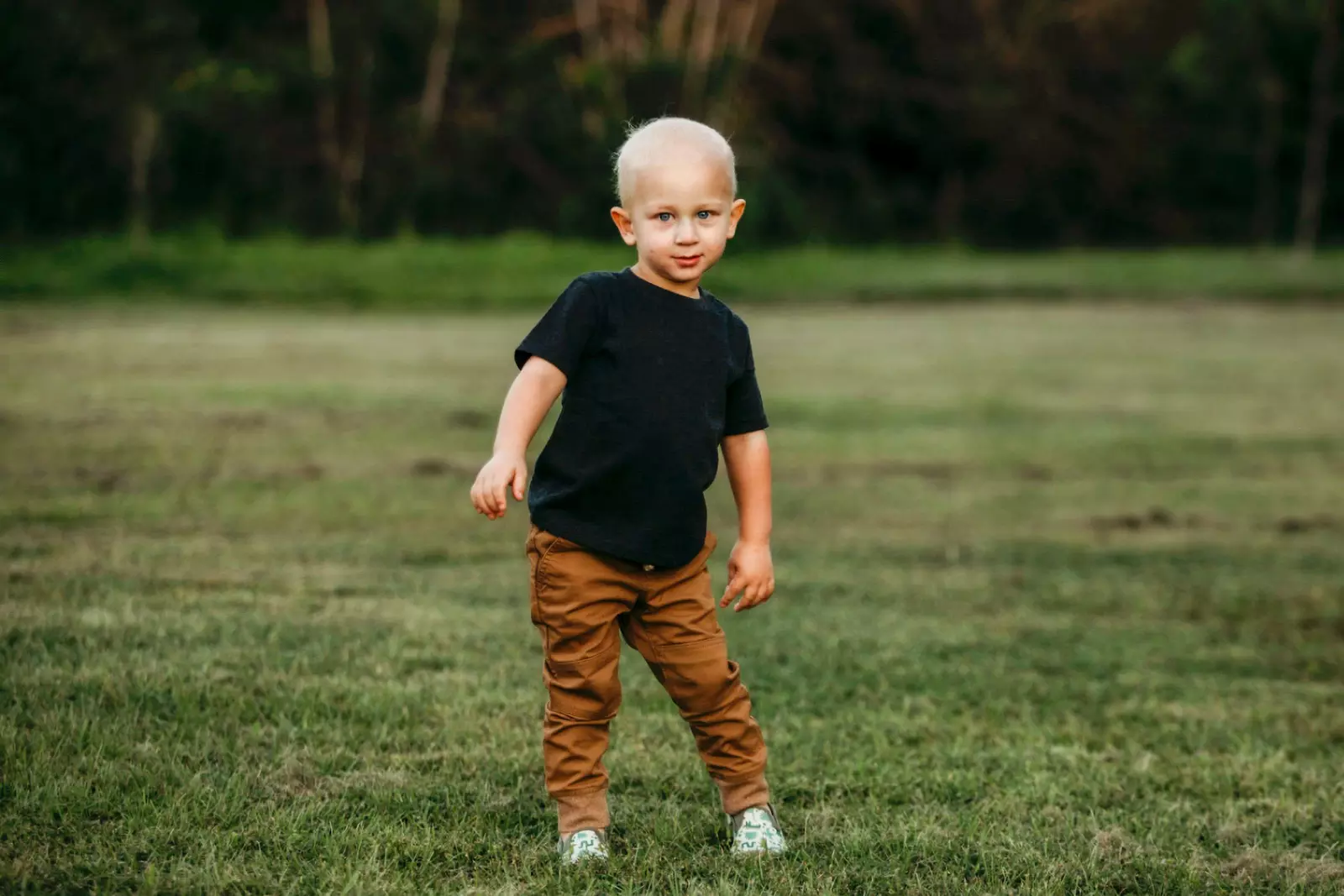 Corbett John standing outside in a field.