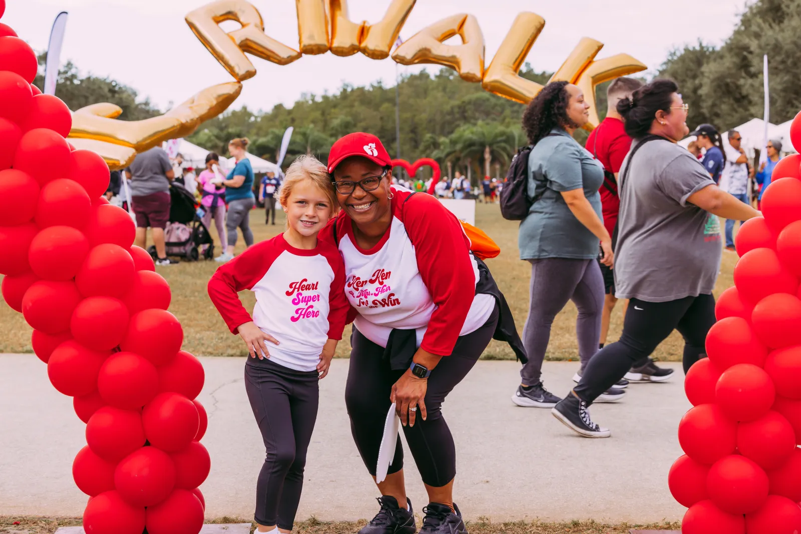 Kennedy Vogt with her kindergarten teacher Mrs. Honor at the Greater Orlando Heart Walk.