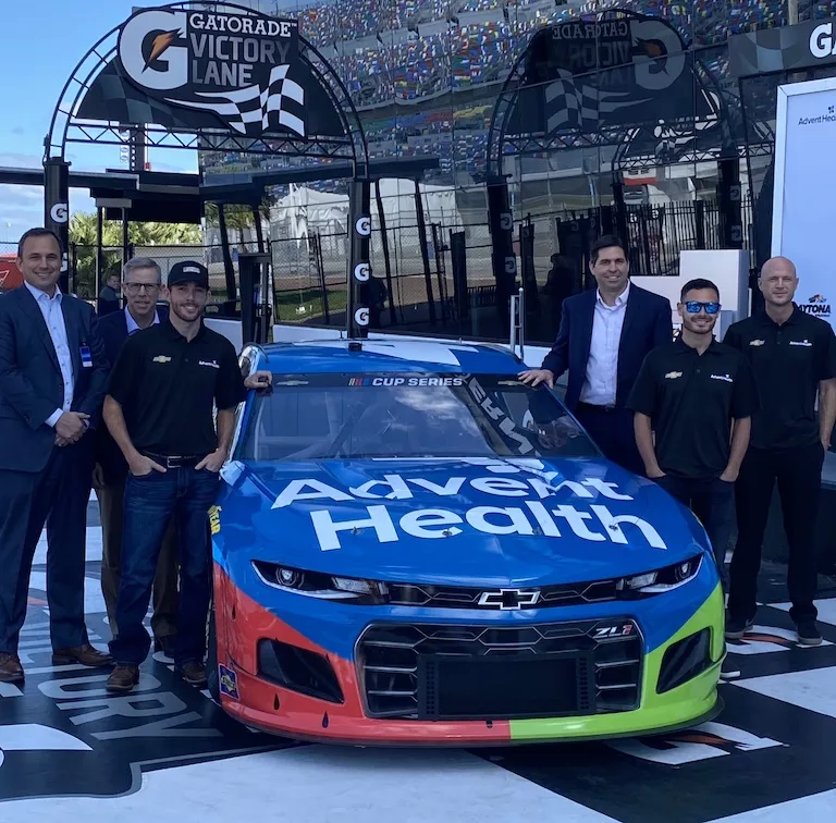 AdventHealth and Chip Ganase racing.