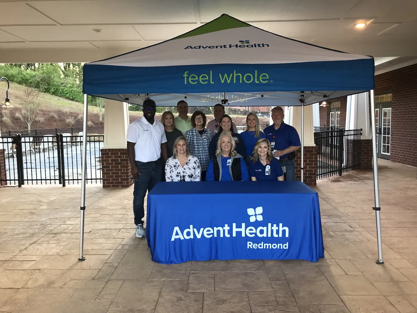 The team from AdventHealth Redmond proudly supports cancer screenings in the Rome-Floyd community. Pictured left to right in back are Terrence Hight, Lori Johnston, Michael Moody, Gerrice Raines, Brandon Lindley, Amanda Faulkenberry, Ashlee Charles, Marty Robinson  Table-Angie Terry, Sissy Charles and Tammy Jarrell.