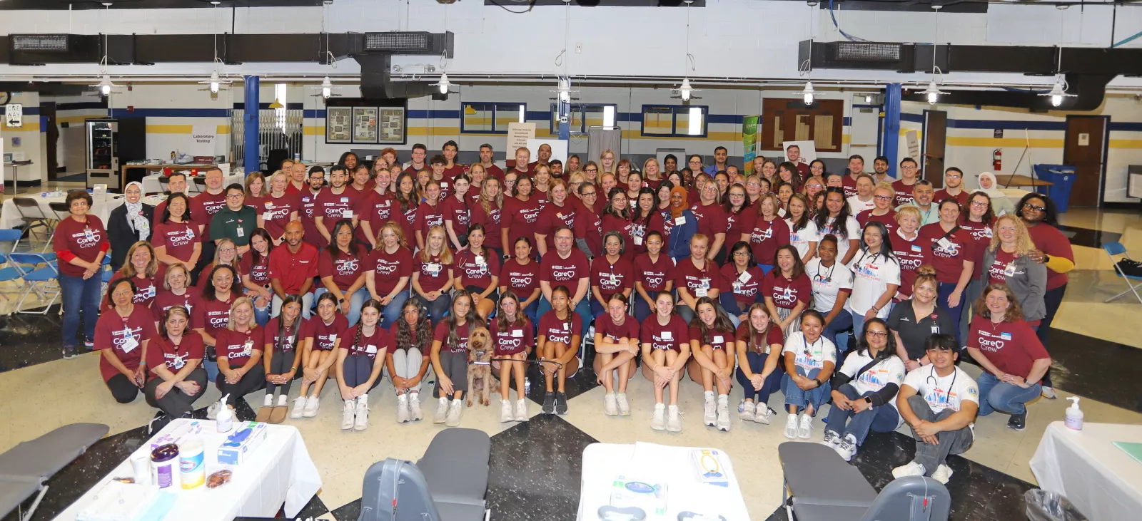 Bela Nand, MD, pictured on the far left, with a group of UChicago Medicine AdventHealth team member volunteers from across the region.