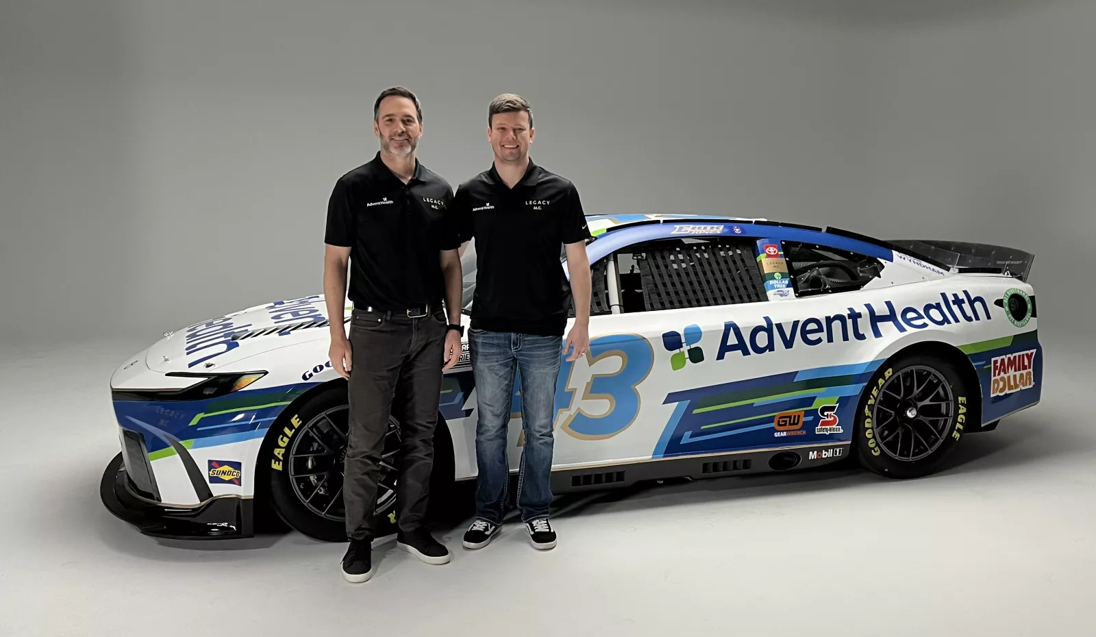 Jimmie Johnson and Erik Jones with AdventHealth race car