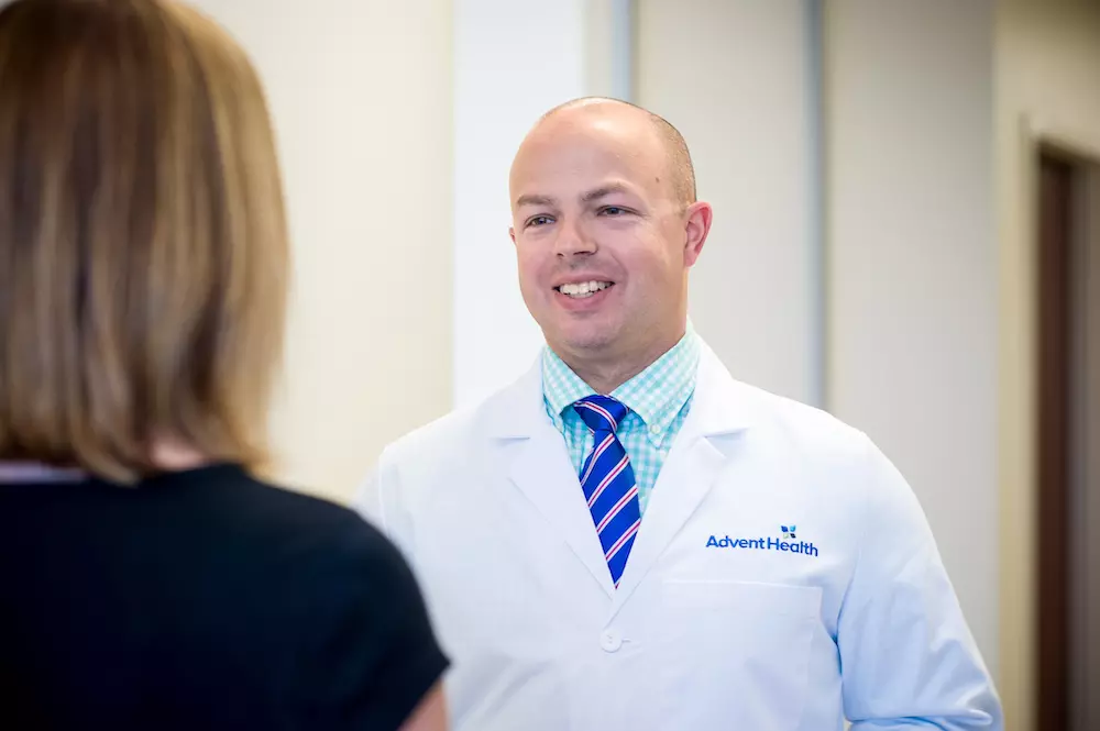 Dr. Land meets with patient about her hip health