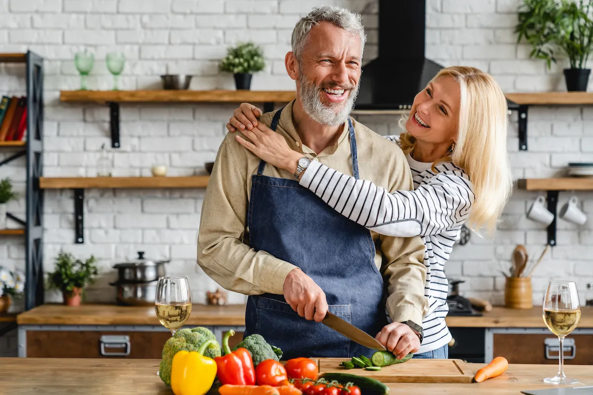 couple cooks healthy foods together