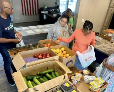 Team members volunteer at Mobile Market 2 Go