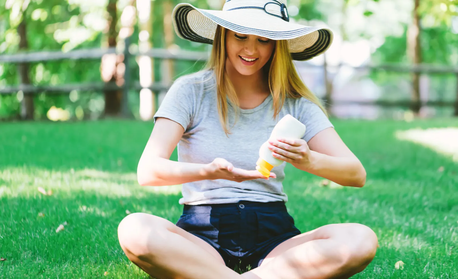 Woman Applying Sunscreen