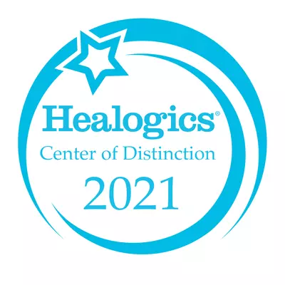 Healogics® Center of Distinction for Wound Care logo.